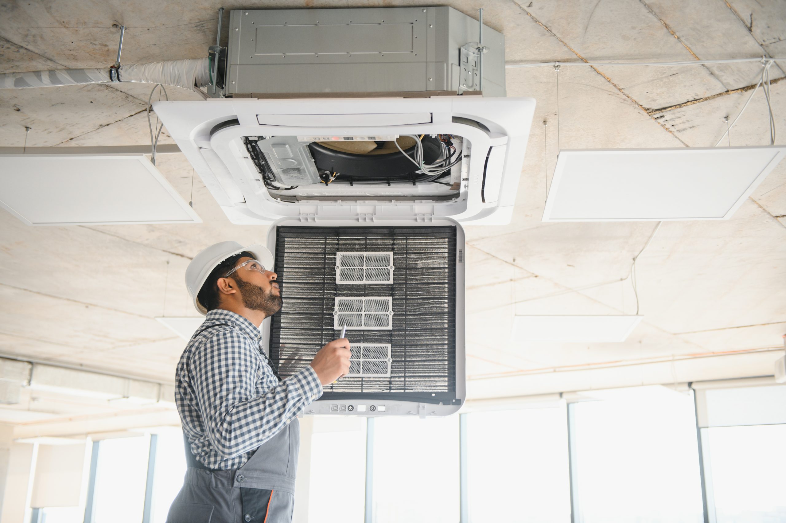 Facility manager monitors HVAC systems in a Houston high-rise, ensuring optimal commercial indoor air quality.